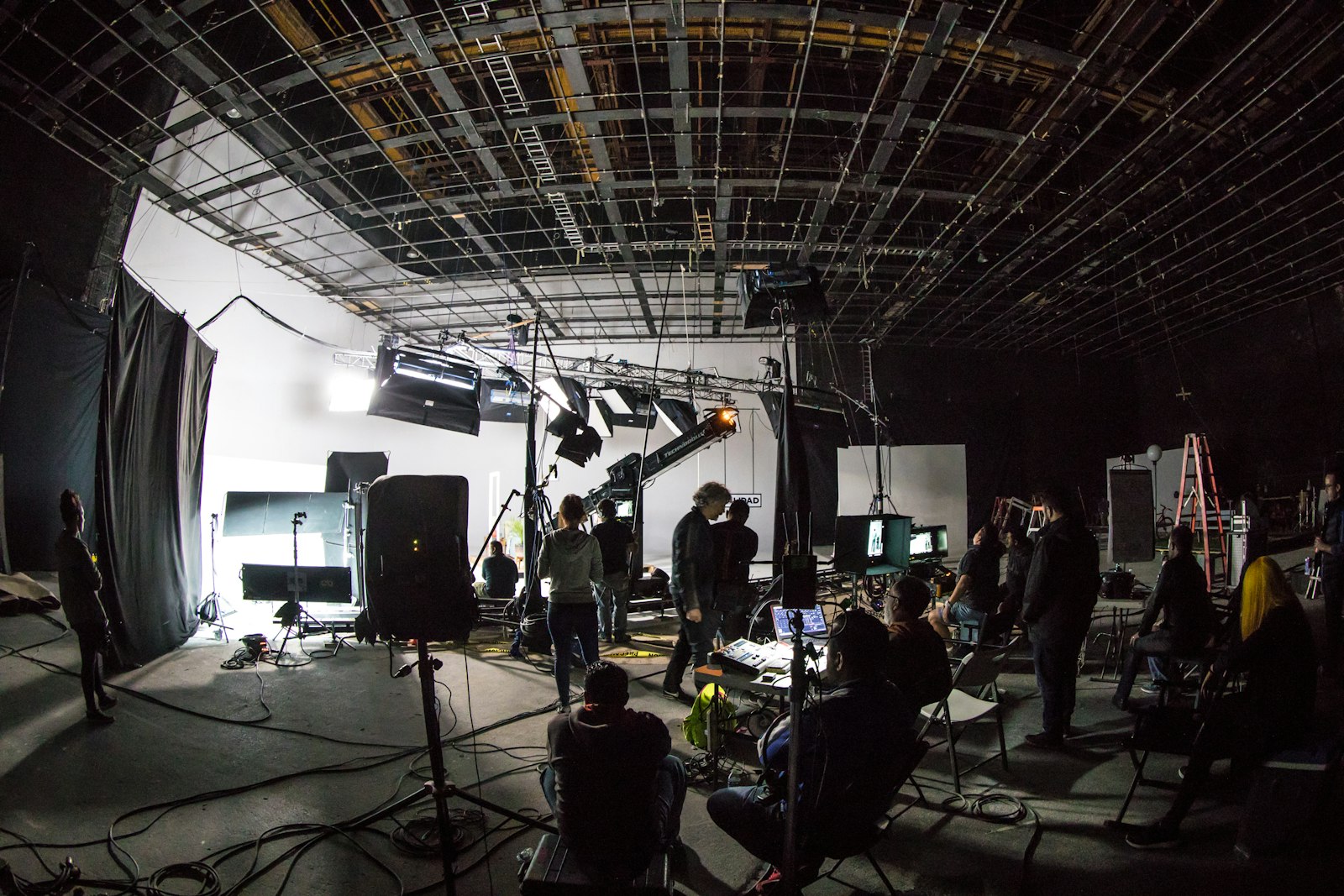 A lit cyclorama and lighting rig on a film soundstage.